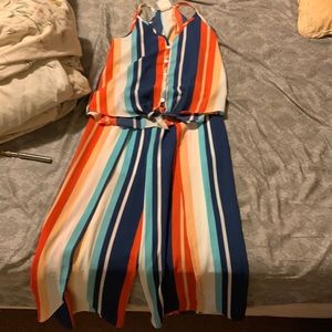 Two piece outfit with slitted pants.